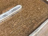 a metal tray with a lid that has a handle on it
