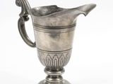 a silver vase with a handle on a white background