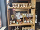 a wooden shelf filled with various items in a room