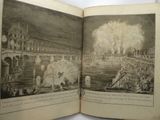 an open book with a picture of a city on it