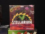 a box of stellarion next to a box of card games