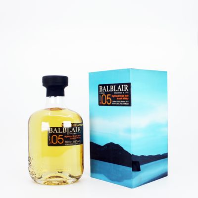 a bottle of balblair 005 whisky next to a box