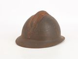 an old helmet is sitting on a white surface