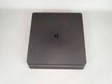 a black box that is sitting on a white surface