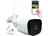an image of a white camera and a hand holding a cell phone