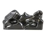 a black sculpture of a pair of shoes on a white surface