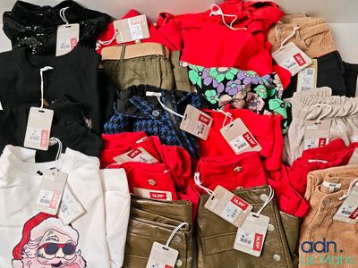 a lot of clothes that are on display in a box
