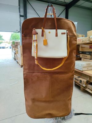 a brown bag that is sitting on a cart in a warehouse