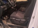 a picture of the inside of a car with the driver ' s seat up