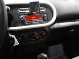 a dashboard of a car with a digital clock on it