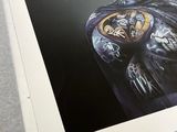 a picture of a batman poster on a table