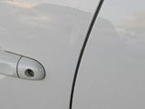 a close up of a car door handle with the door handle open