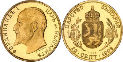 a close up of a gold coin with a crown on it
