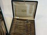 a box with a set of forks and spoons in it