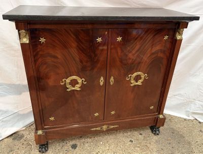 an image of a wooden cabinet with a star design on the front