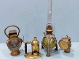 four different types of antique brass objects on a table
