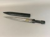 two knives that are sitting next to each other on a table