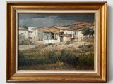 une image représentant un tableau d'un village, dans un cadre doré