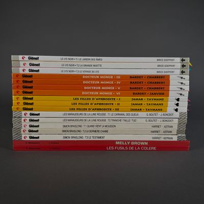 several books stacked on top of each other on a table