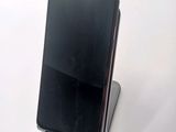 a cell phone that is sitting on top of a stand