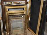 several frames are stacked on top of each other in a room