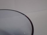 a close up of a glass of wine on a table
