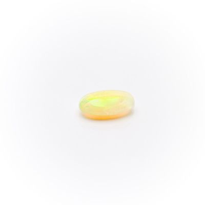 a yellow oplite gems on a white background