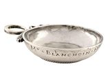 a silver plate with a handle and a handle on it