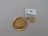 a gold coin with a peace sign on it
