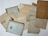 a pile of old papers on a white surface