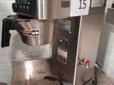 a coffee maker sitting on a counter in a kitchen