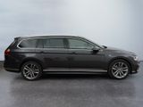 the volkswagen passat is parked in a parking lot with a sky background
