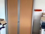 a room with two doors and a washer and dryer in it