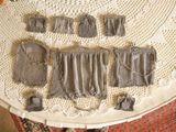 a table with several pieces of cloth on top of it