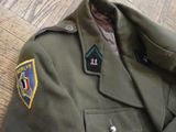 a military uniform with a badge on it
