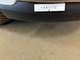 a close up of the front bumper of a car with a sticker on it