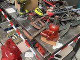 a lot of tools on a workbench in a garage