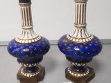 two vases that are sitting on a table