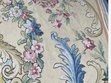 a rug with a picture of a bird and flowers on it