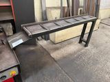 a bench made out of metal and a table made out of wood