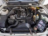 a car engine with its hood open on the street