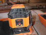 an orange and black machine that is sitting on a table