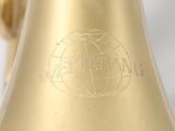 a gold bell that is sitting on a table