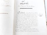 an open book with writing on it sitting on a table