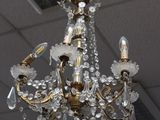 a chandelier hanging from the ceiling in a room
