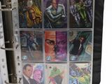 a picture of a binder with a bunch of comics on it
