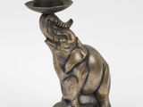 an image of a statue of an elephant with a hat on it ' s head