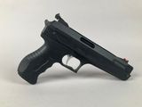 a close up of a gun on a white surface