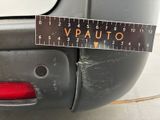 a measuring tape on the back of a car ' s bumper