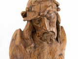 wooden statue of a man with a crown of thorns on his head